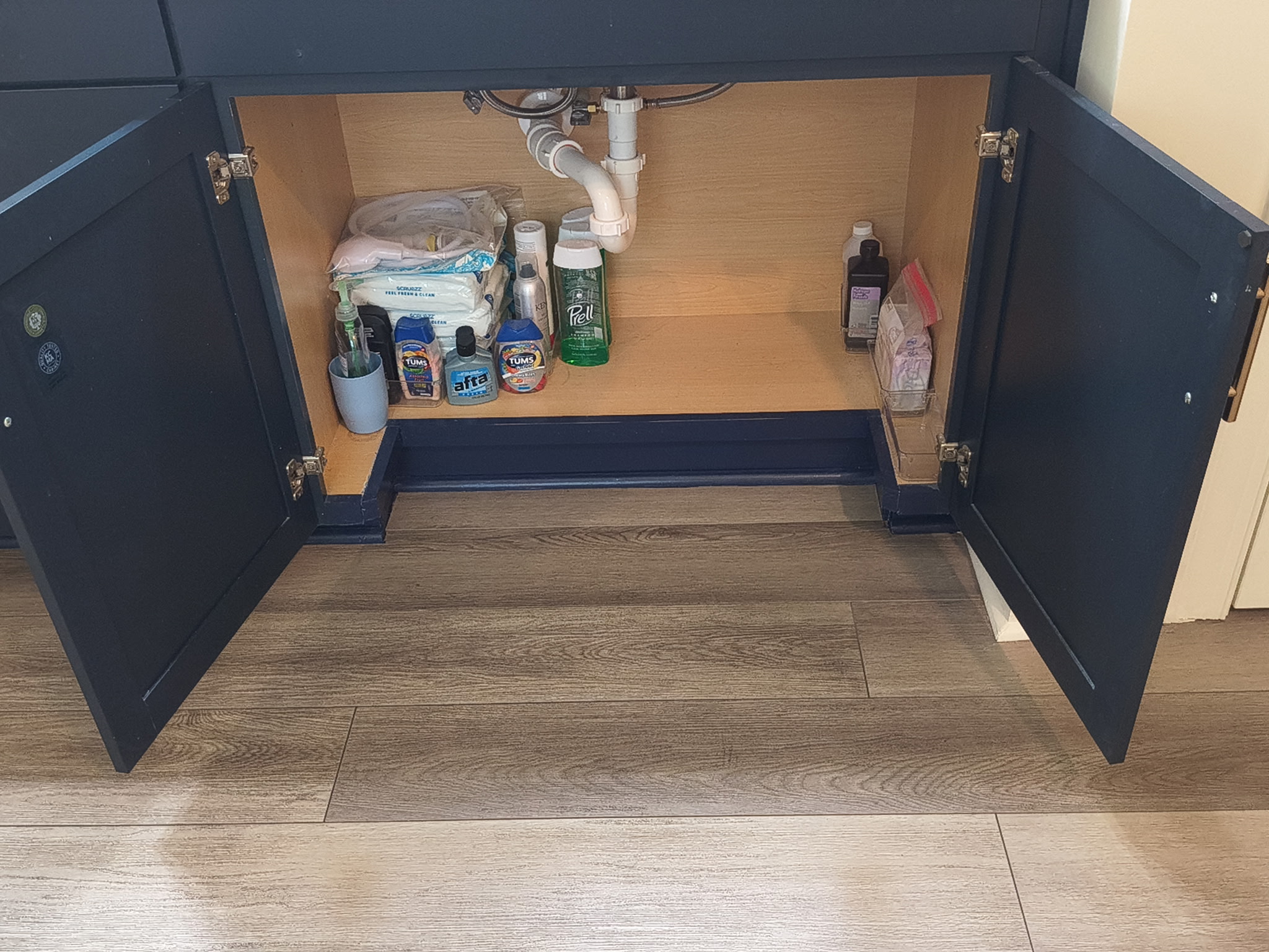 Under-cabinet sink modification showing open knee space for wheelchair access